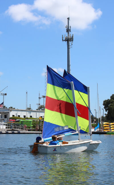 Kids sailing at a watersports summer camp in St. Petersburg, Florida